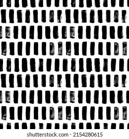 Black brush stripes and vertical strokes. Vector seamless pattern. Geometric grunge texture. Abstract background with short vertical brushstrokes. Modern graphic design in Scandinavian style