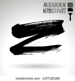 Black brush stroke and handwritten alphabet. Grunge vector abstract hand - painted element. Underline and border design.
