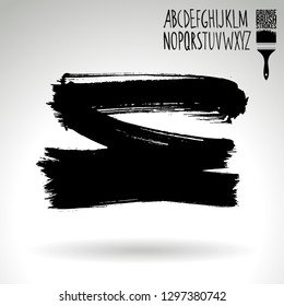 Black brush stroke and handwritten alphabet. Grunge vector abstract hand - painted element. Underline and border design.