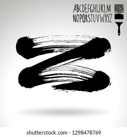 Black brush stroke and handwritten alphabet. Grunge vector abstract hand - painted element. Underline and border design.