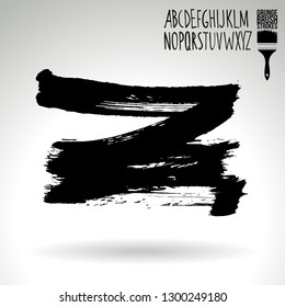 Black brush stroke and handwritten alphabet. Grunge vector abstract hand - painted element. Underline and border design.