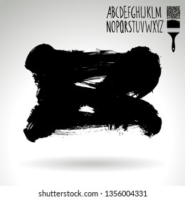 Black brush stroke and handwritten alphabet. Grunge vector abstract hand - painted element. Underline and border design.