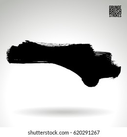 Black brush stroke and texture. Grunge vector abstract hand - painted element. Underline and border.
