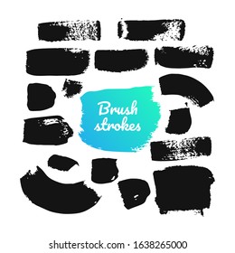 Black brush strokes - set of isolated design elements on white background. A collection of ink paintings, abstract textures, lines and stains. Freehand drawing, gouache dirty marks