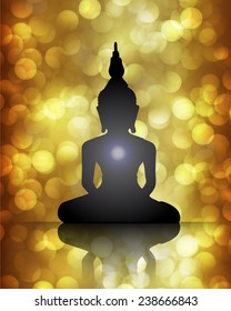 Black Buddha silhouette against brown bokeh defocused lights abstract background 