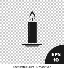 Black Burning candle in candlestick icon isolated on transparent background. Old fashioned lit candle. Cylindrical candle stick with burning flame.  Vector Illustration