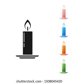 Black Burning candle in candlestick icon isolated on white background. Old fashioned lit candle. Cylindrical candle stick with burning flame. Set icons colorful. Vector Illustration