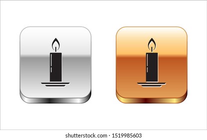 Black Burning candle in candlestick icon isolated on white background. Old fashioned lit candle. Cylindrical candle stick with burning flame. Silver-gold square button. Vector Illustration