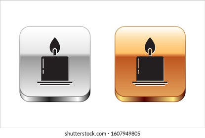 Black Burning candle in candlestick icon isolated on white background. Cylindrical candle stick with burning flame. Silver-gold square button. Vector Illustration