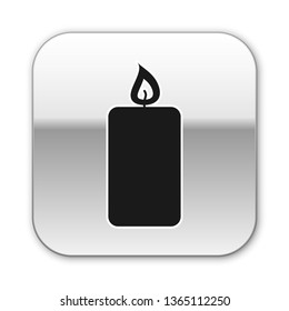 Black Burning candle icon isolated on white background. Old fashioned lit candle. Cylindrical aromatic candle stick with burning flame. Silver square button. Vector Illustration