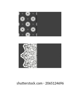 Black business card with antique white ornament for your contacts.
