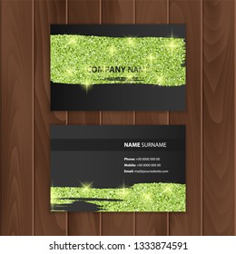 Black business card with glittering texture of green color, visit card on a wooden substrate, Vector EPS 10 illustration