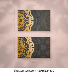 Black business card template with Greek gold pattern for your personality.