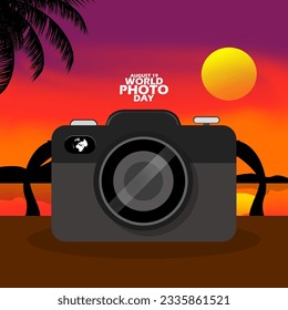 A black camera on a brown table with a panoramic sunset background, with bold text to commemorate World Photo Day on August 19