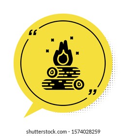 Black Campfire icon isolated on white background. Burning bonfire with wood. Yellow speech bubble symbol. Vector Illustration