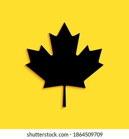 Black Canadian maple leaf icon isolated on yellow background. Canada symbol maple leaf. Long shadow style. Vector.