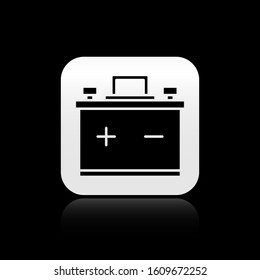 Black Car battery icon isolated on black background. Accumulator battery energy power and electricity accumulator battery. Silver square button. Vector Illustration