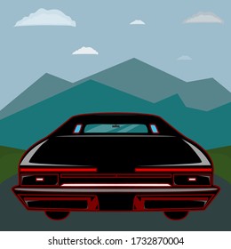 Black car with red design riding into mountains 