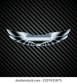 Black carbon background with chrome metal wings silhouette emblem