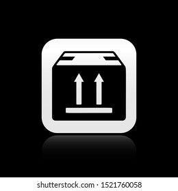 Black Cardboard box with traffic symbol icon isolated on black background. Box, package, parcel sign. Delivery, transportation and shipping. Silver square button. Vector Illustration