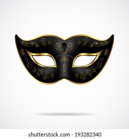 Black carnival mask with gold ornament isolated on white