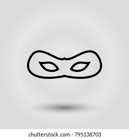 Black carnival mask for masquerade costume. Isolated on grey background