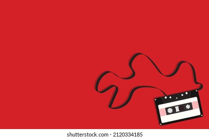 casete negro con cinta en fondo rojo