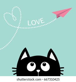 Black cat looking up to pink flying origami paper plane. Dashed line Heart loop Love text. Cute cartoon animal character. Valentines Day. Greeting card Flat design Blue background Vector
