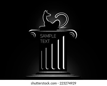 black cat on a column in light