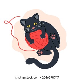 Gato negro jugando con una bola de hilo rojo