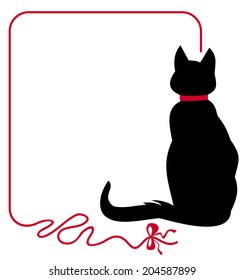 Black cat in red collar is sitting back to the audience