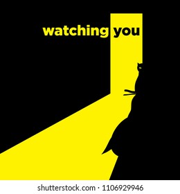 A black cat in a black room looks at you.