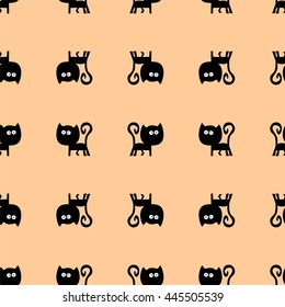 Black cat seamless pattern on yellow background