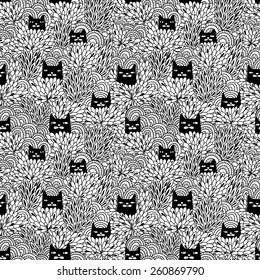 Black cats looking  out of the bushes. Seamless pattern 