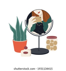 Black cat's reflection in the mirror. Happy pet owner. Selfie girl holding a smartphone