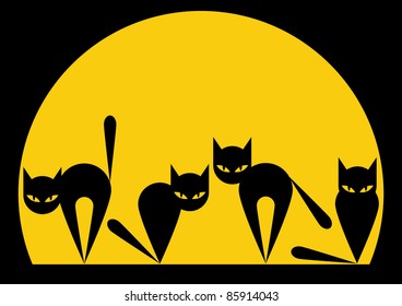 Black cats sit before the yellow moon on the eve of a Halloween.