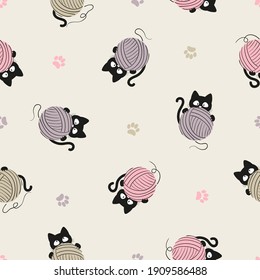 Black cats with yarn balls pattern. Seamless knitting background.