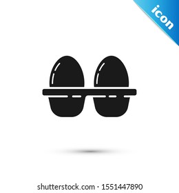 Black Chicken egg in box icon isolated on white background.  Vector Illustration