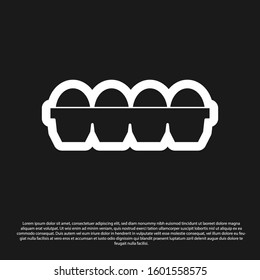 Black Chicken egg in box icon isolated on black background.  Vector Illustration