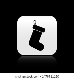 Black Christmas sock icon isolated on black background. Square button vector Illustration