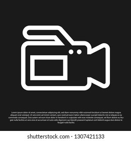 Black Cinema camera icon isolated on black background. Video camera. Movie sign. Film projector. Vector Illustration