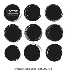 Black circle frames of thick textured paint smears isolated on white background