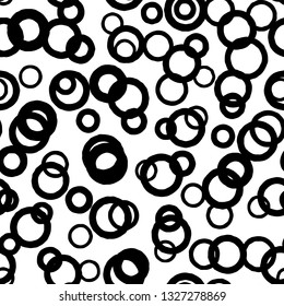 Black circle seamless pattern with intersecting hand drawn thick and thin outline rings. Vector chaotic monochrome texture with round contour shapes isolated on white background.
