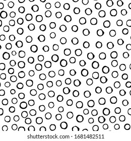 Black circles are arranged in random order with a void inside on an isolated background. Vecton illustration. Stock illustration. You can use the pattern on wrapping paper or fabric.