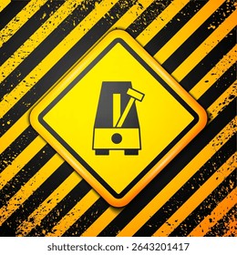 Black Classic Metronome with pendulum in motion icon isolated on yellow background. Equipment of music and beat mechanism. Warning sign. Vector