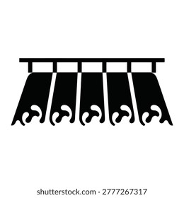 Black coat rack with five hooks hanging on wall