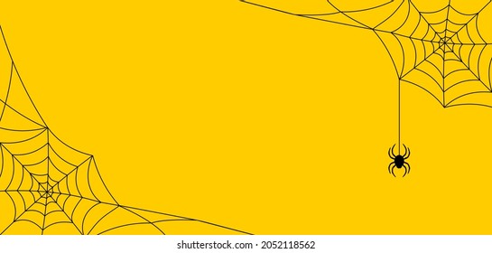 Black cobweb with spider on a yellow background. Halloween frame with copy space