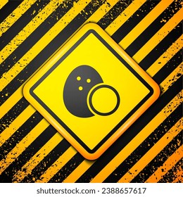 Black Coconut icon isolated on yellow background. Warning sign. Vector