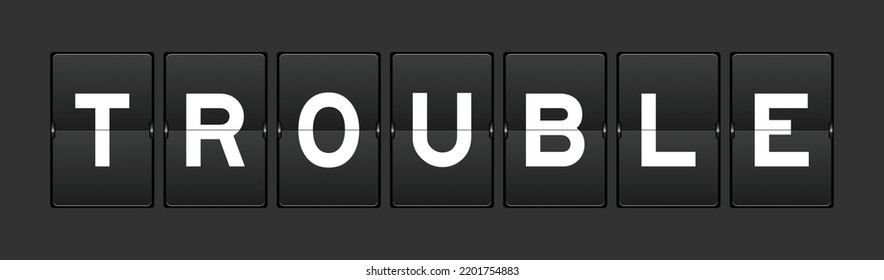 Black color analog flip board with word trouble on gray background