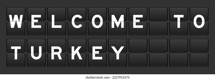 Black color analog flip board with word welcome to turkey on gray background